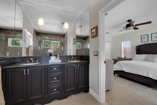 bathroom featuring tile patterned flooring, ceiling fan, walk in shower, and vanity