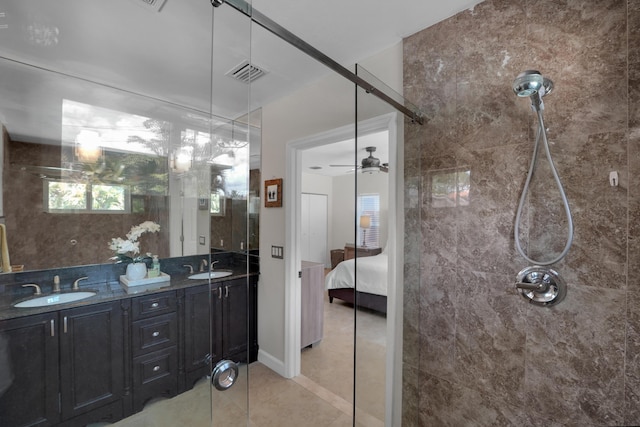 bathroom featuring tile patterned flooring, ceiling fan, and vanity