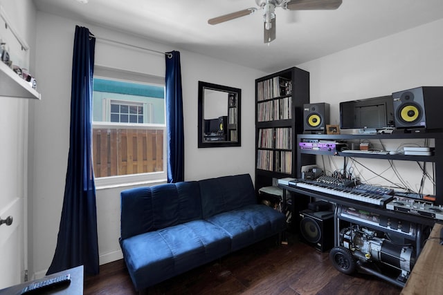 interior space with ceiling fan and dark wood-type flooring