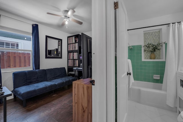 living room with ceiling fan and wood-type flooring