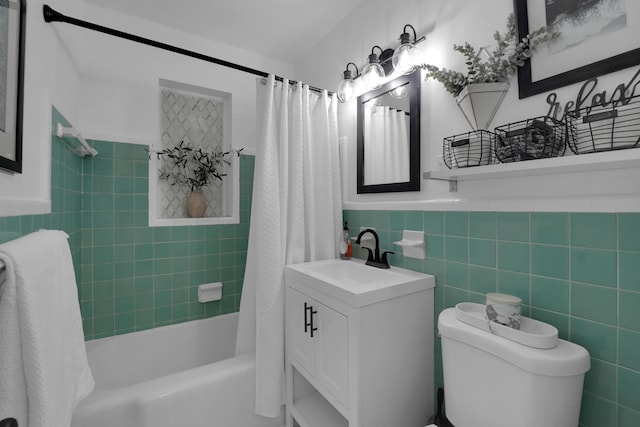 1305 NE 1st Ave, Fort Lauderdale, FL 33304 - bathroom with shower / bath combo, vanity, toilet, tile walls, and a wainscoted wall