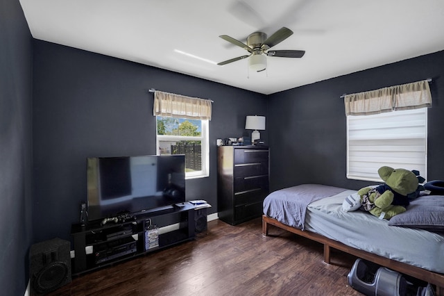 bedroom with ceiling fan and dark hardwood / wood-style flooring