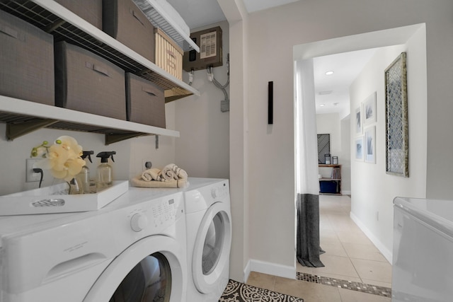 1305 NE 1st Ave, Fort Lauderdale, FL 33304 - laundry room featuring washer and clothes dryer, light tile patterned flooring, baseboards, and recessed lighting