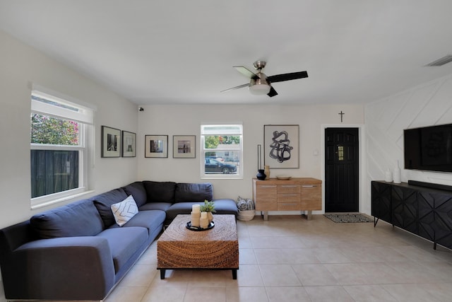 tiled living room featuring plenty of natural light and ceiling fan