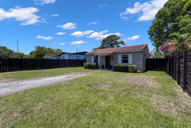 1305 NE 1st Ave, Fort Lauderdale, FL 33304 - back of property with a tiled roof and stucco siding