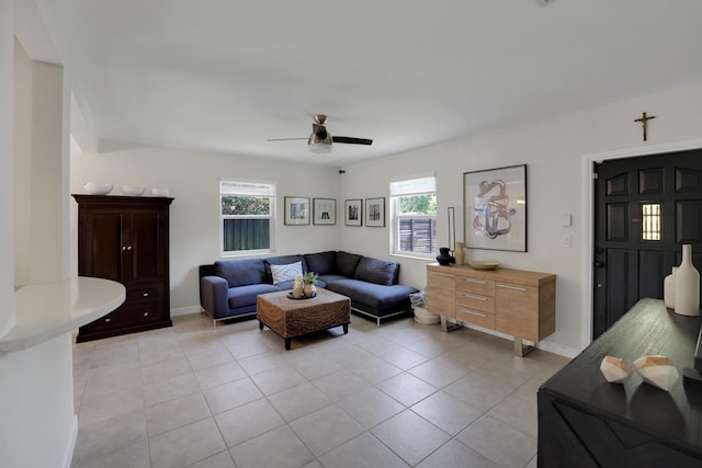 living room with light tile patterned floors and ceiling fan