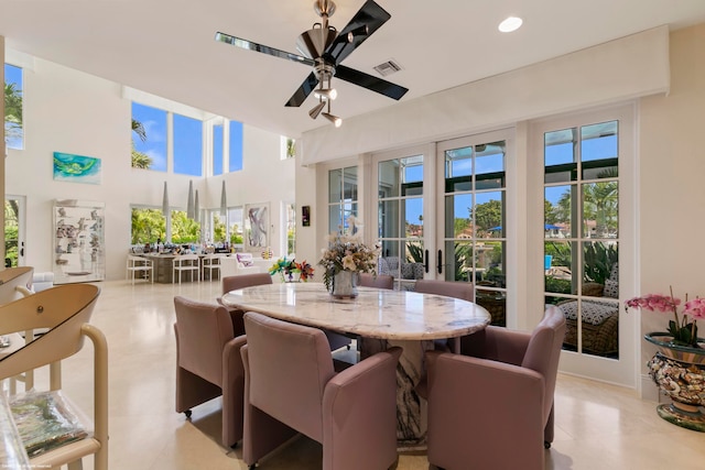 tiled dining room with ceiling fan