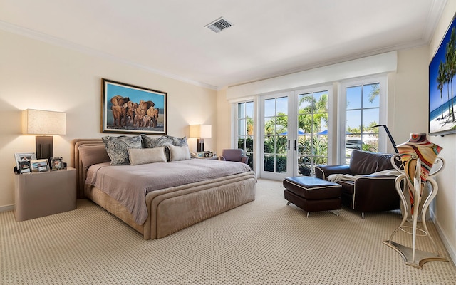 carpeted bedroom with french doors and crown molding