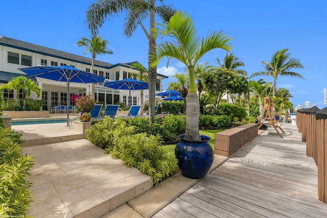 view of community with a patio and a swimming pool