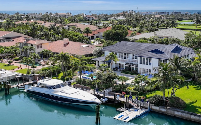 birds eye view of property with a water view