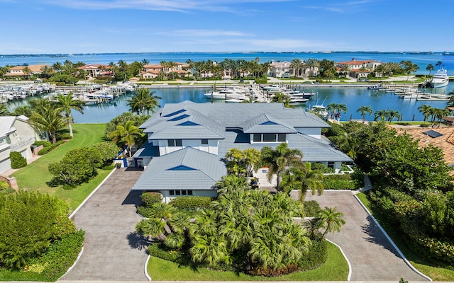 birds eye view of property with a water view