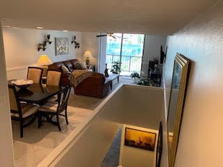 dining room featuring sink, a textured ceiling, and light tile patterned flooring