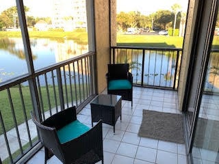 balcony featuring a water view