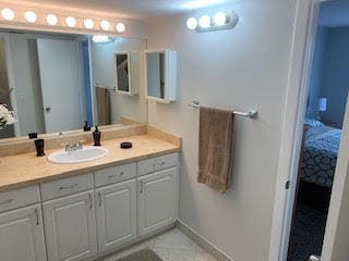 bathroom featuring tile patterned flooring and vanity