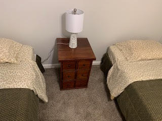 bedroom with dark colored carpet