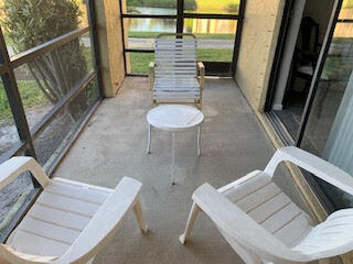 unfurnished sunroom with a water view