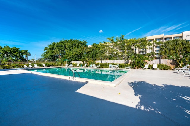 view of swimming pool with a patio