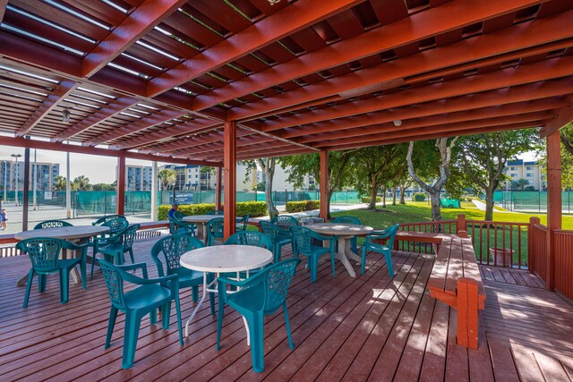 view of community with a patio, a yard, and a pergola