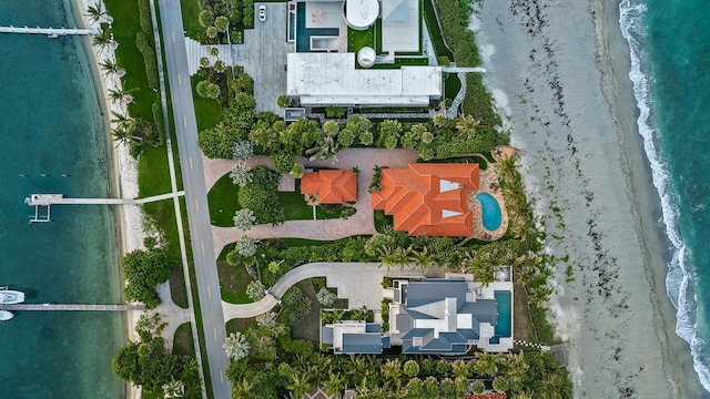 drone / aerial view with a beach view and a water view