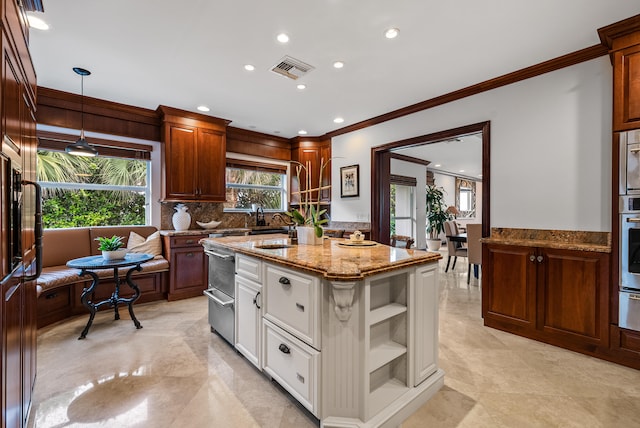 bathroom with crown molding and vanity