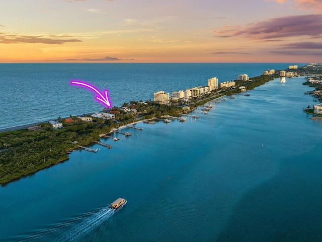 aerial view at dusk with a water view