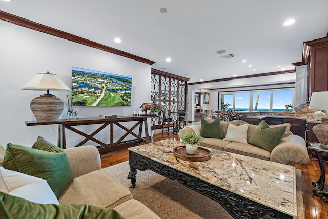 living room featuring ornamental molding and hardwood / wood-style floors