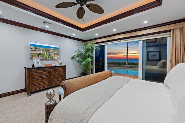 bedroom with a raised ceiling, access to exterior, light carpet, ceiling fan, and ornamental molding