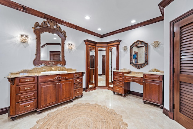 bathroom featuring crown molding and vanity