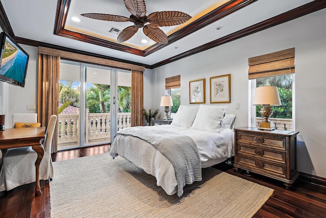 bedroom featuring a raised ceiling, crown molding, ceiling fan, dark hardwood / wood-style floors, and access to outside