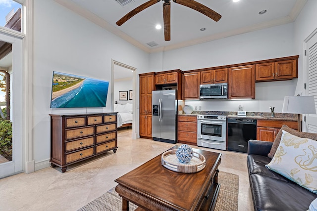 kitchen with sink, ceiling fan, a high ceiling, crown molding, and appliances with stainless steel finishes