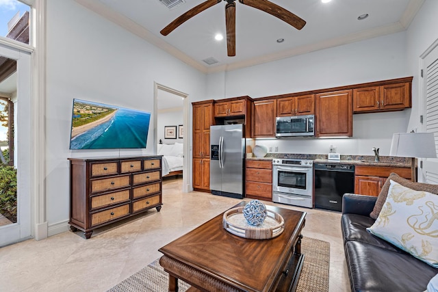 kitchen with stainless steel appliances, visible vents, ornamental molding, and a towering ceiling