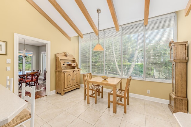 dining room featuring light tile patterned floors, a notable chandelier, and vaulted ceiling with beams