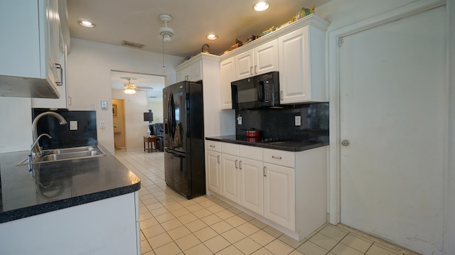 kitchen featuring white cabinetry, sink, tasteful backsplash, and black appliances