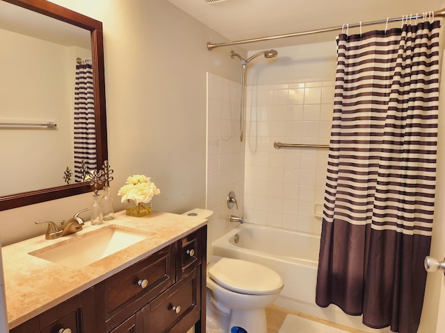 bathroom featuring shower / tub combo, vanity, and toilet