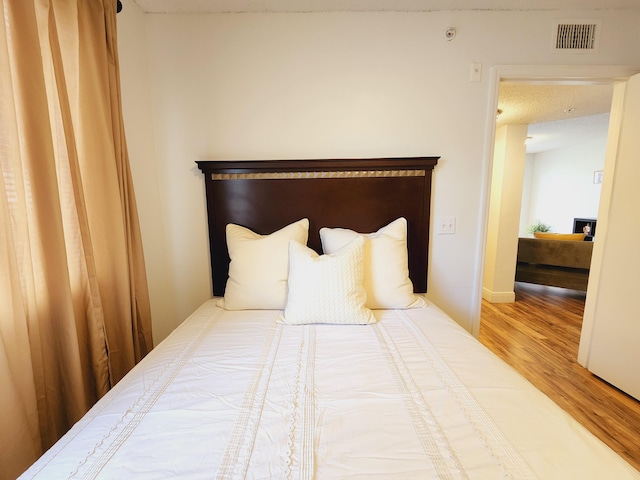 bedroom with light wood-type flooring