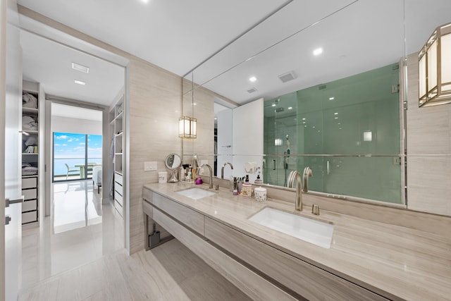 bathroom with vanity and tile walls