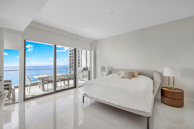 tiled bedroom featuring access to exterior and a water view