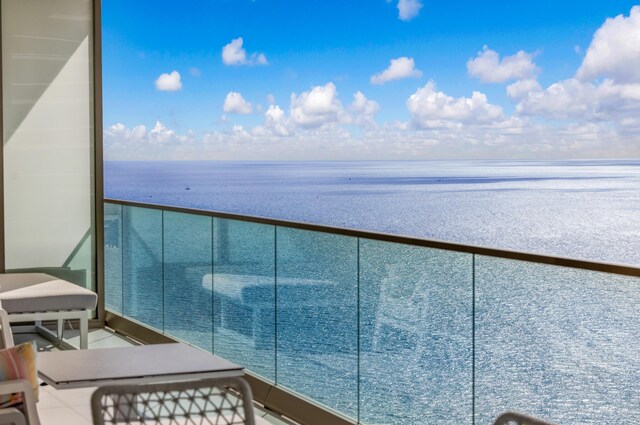 balcony featuring a water view