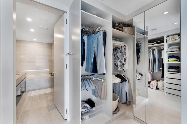 spacious closet with light tile patterned flooring