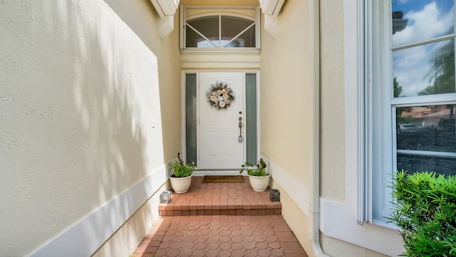 doorway to property featuring a wall unit AC