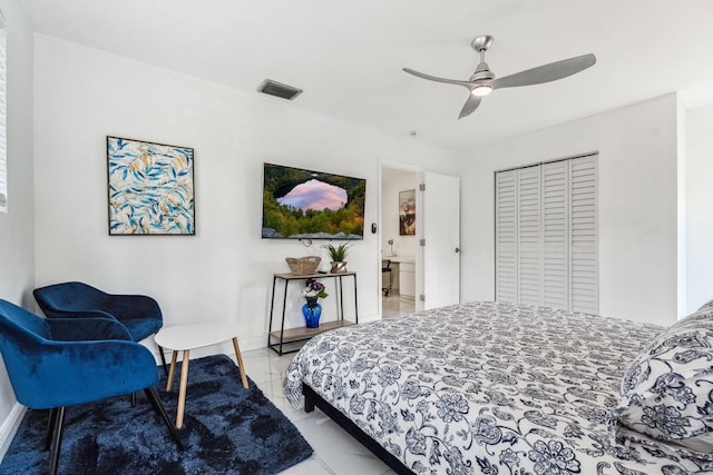 bedroom with visible vents, baseboards, and a ceiling fan