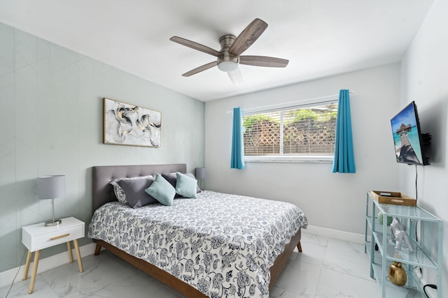 bedroom with baseboards, marble finish floor, and ceiling fan