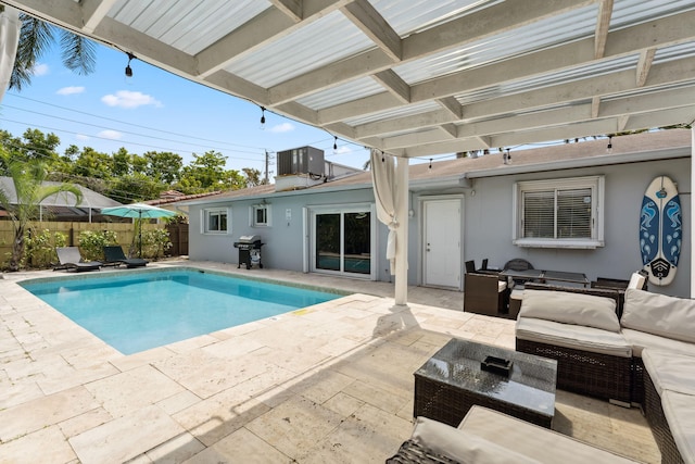 view of swimming pool featuring a patio, fence, area for grilling, a pergola, and an outdoor hangout area