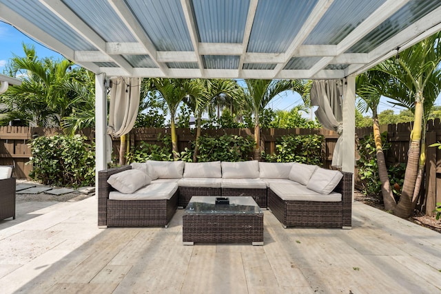 view of patio / terrace featuring an outdoor living space and a fenced backyard