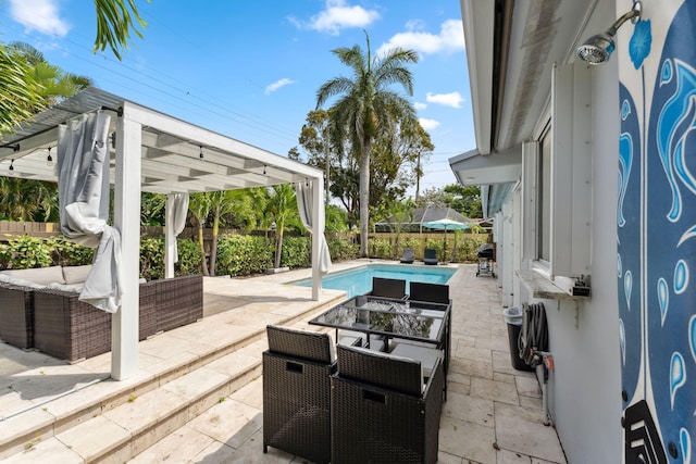 view of patio featuring a fenced in pool, fence, and a pergola