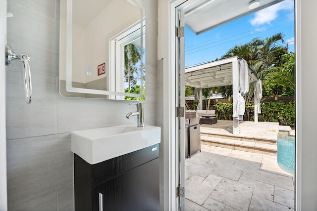 bathroom featuring vanity and stone tile flooring