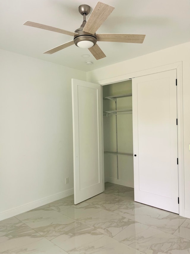 unfurnished bedroom featuring tile patterned floors, a closet, and ceiling fan