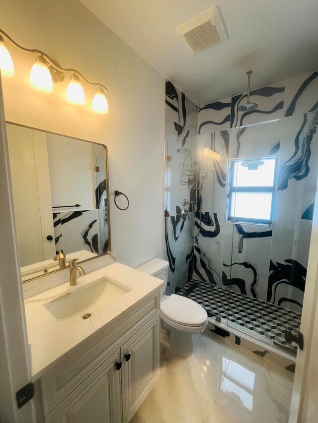 bathroom featuring vanity, walk in shower, tile patterned flooring, and toilet