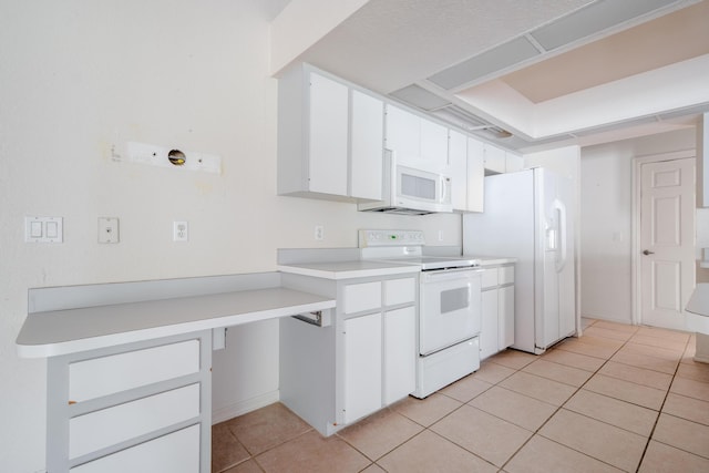 kitchen featuring white cabinets, white appliances, and light tile patterned floors