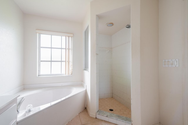 bathroom featuring vanity, separate shower and tub, and tile patterned floors